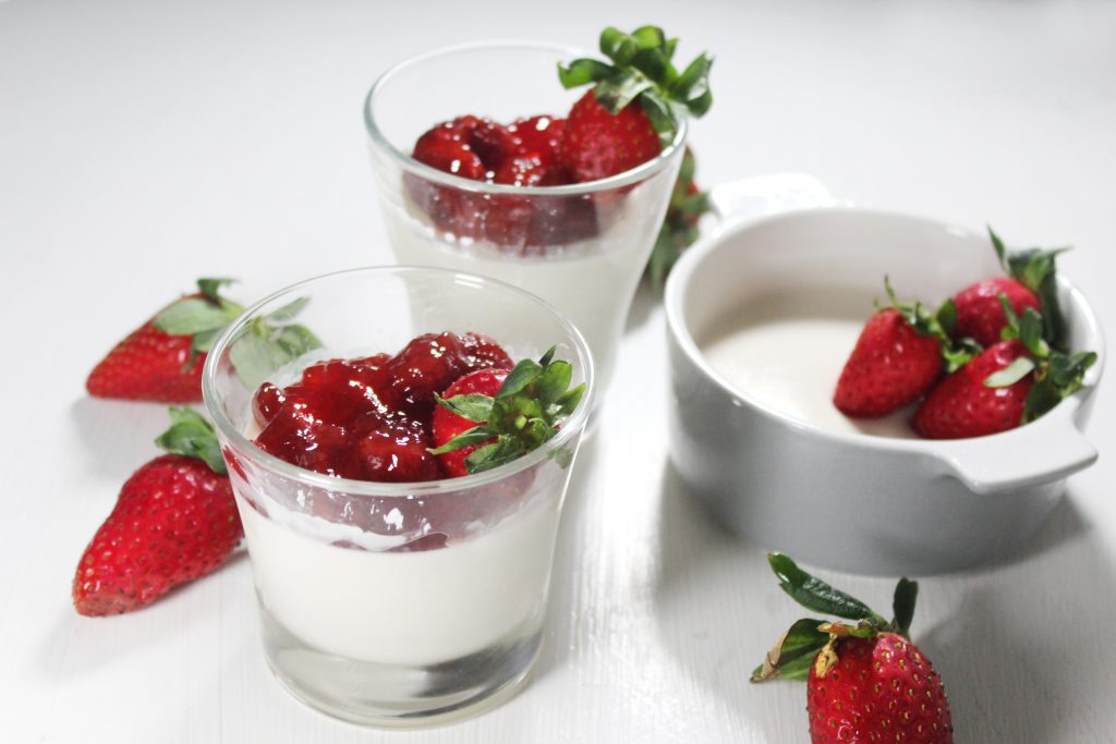 Close-up shot focusing on the smooth gelatinous texture of the panna cotta dessert.