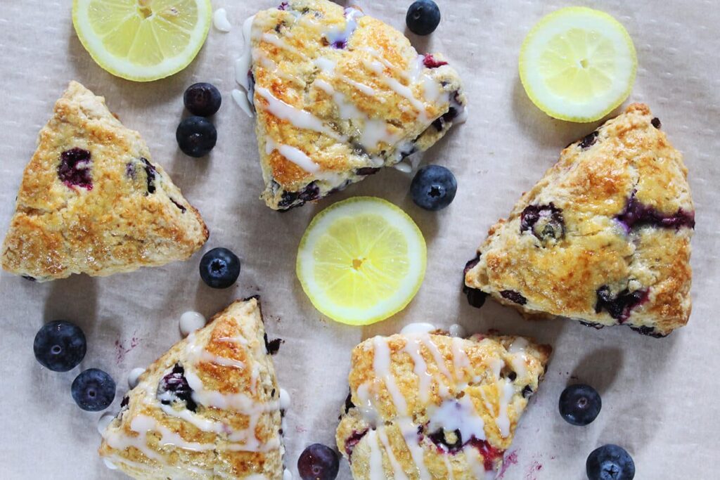 Overhead view displaying the triangular batch layout of the finished blueberry lemon scones.