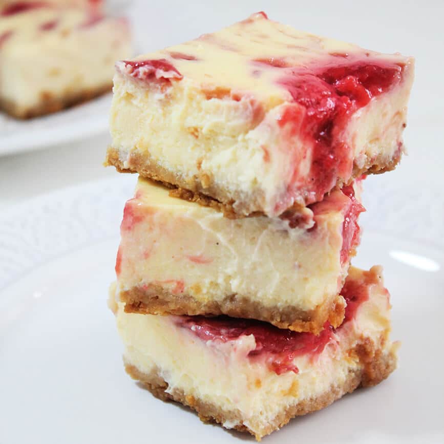 Photograph of the recipe for layered strawberry swirl cheesecake bars.