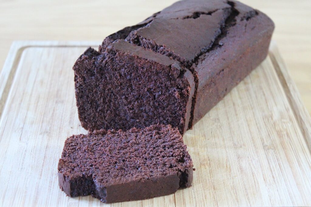 Side perspective displaying the entire baked loaf of the chocolate pound cake.