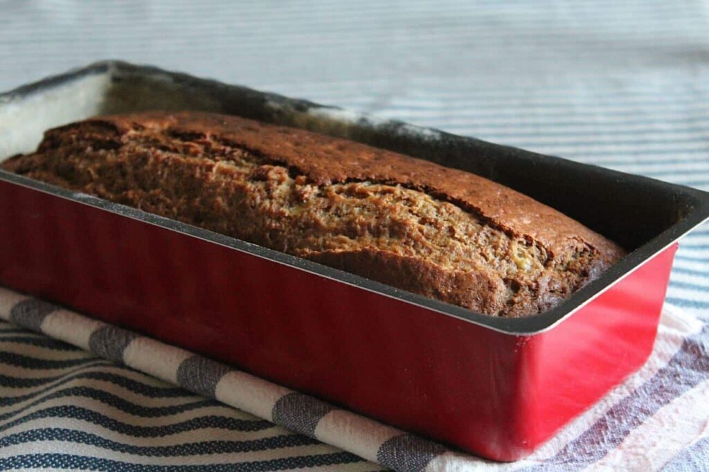 Side perspective displaying the height and texture of the sliced healthy banana bread.