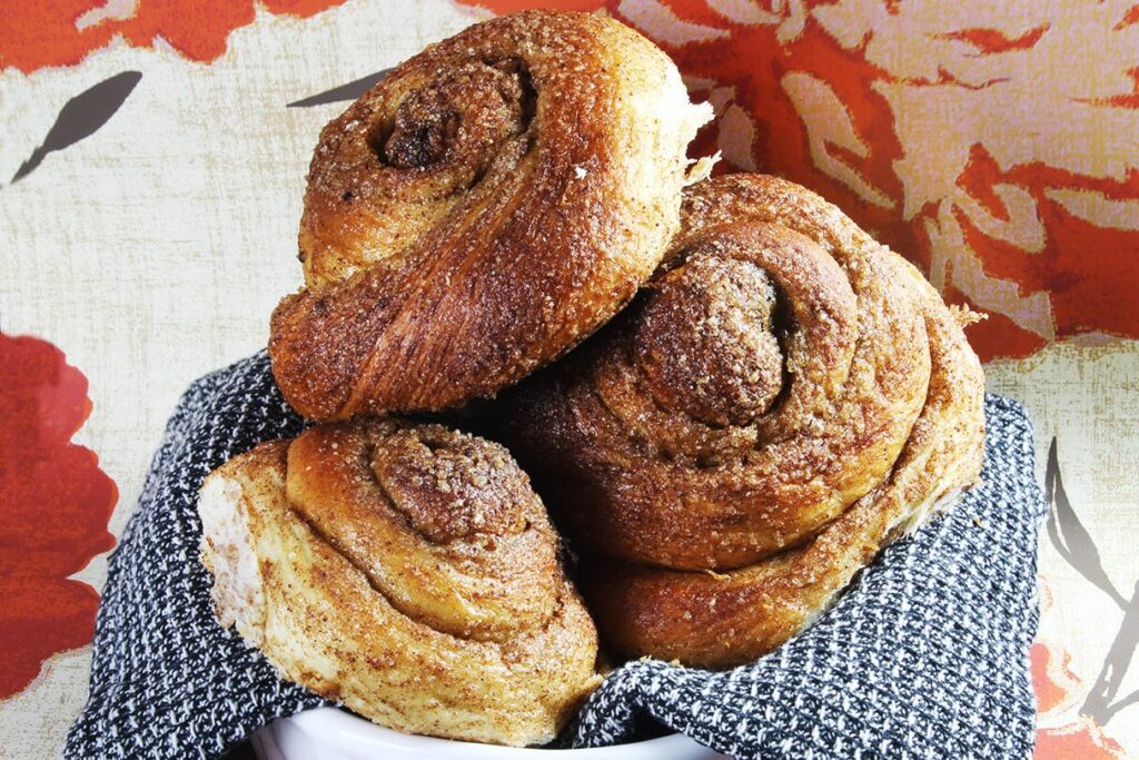Presentation of the traditional baked zeeuwse bolussen dutch cinnamon rolled bread.