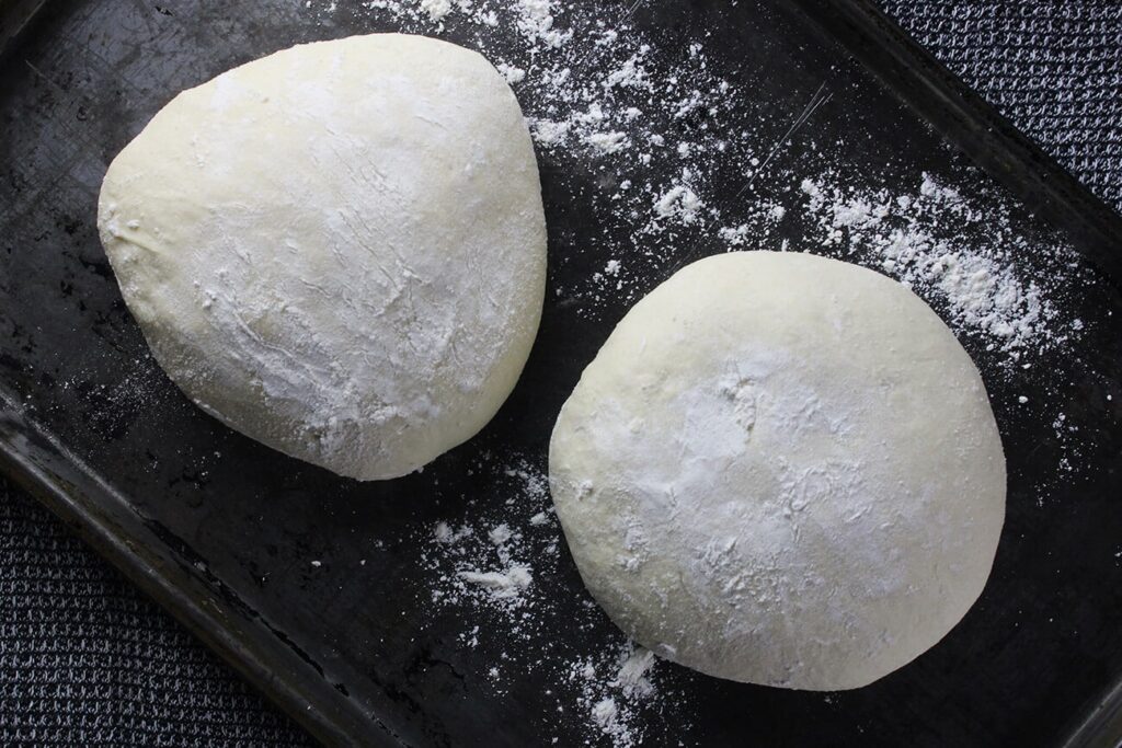 Overhead view showing the rolled out flat layer of the best pizza dough.