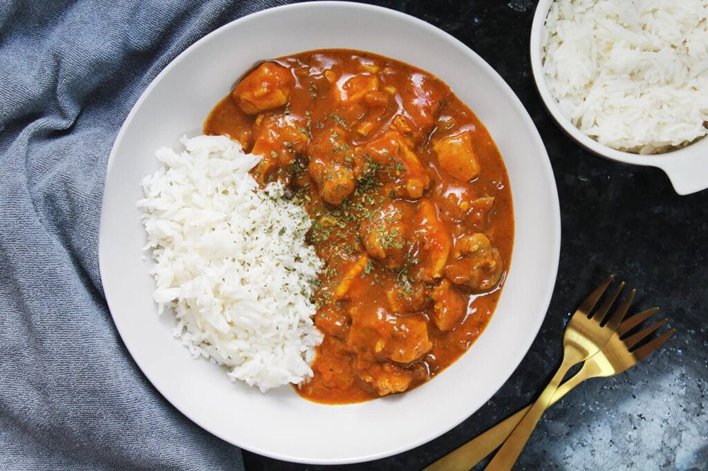 Overhead view displaying the finished easy coconut chicken curry dish.