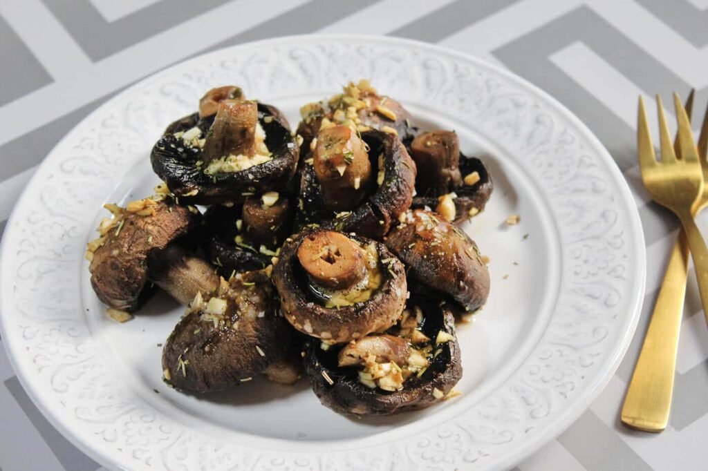 Side perspective highlighting the serving arrangement of the garlic butter mushrooms side dish.