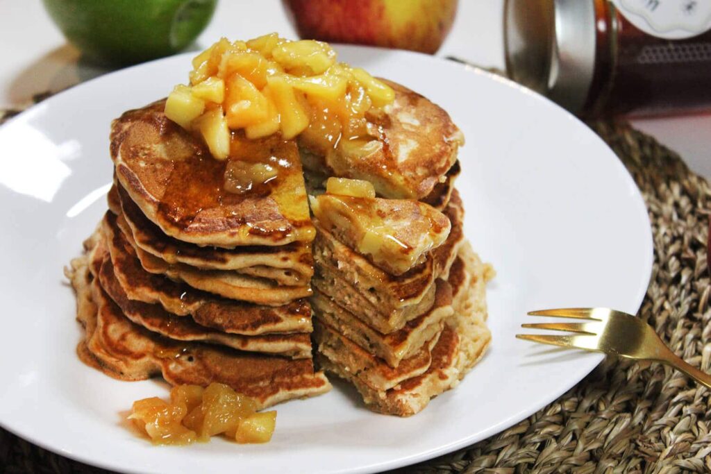 Side perspective highlighting the height of the stacked apple pancakes pile.