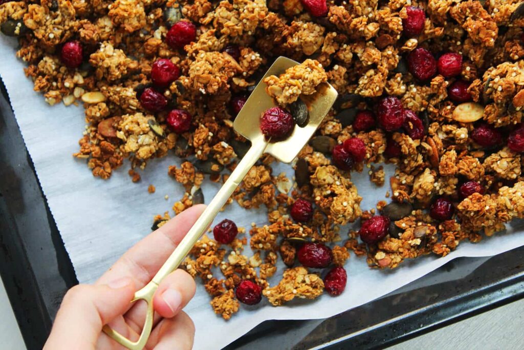 Side perspective showing the texture and seed components of the pumpkin spice granola.