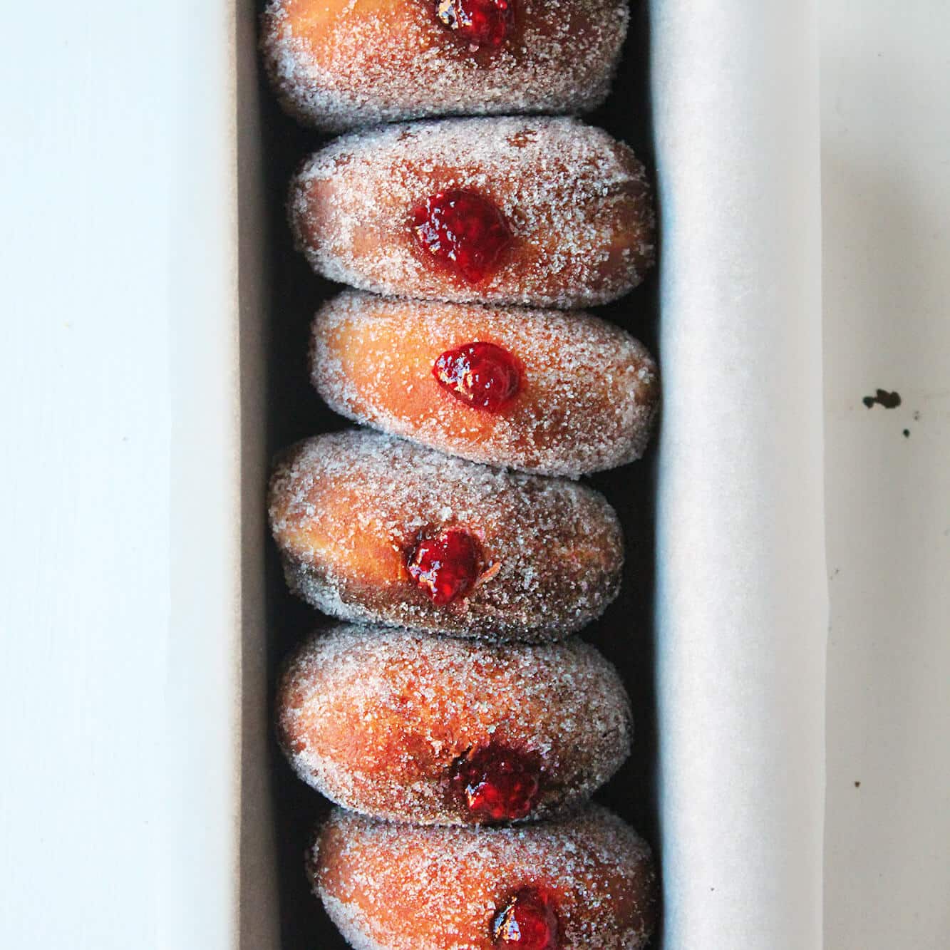 Photograph of the recipe for soft sugar-coated marmalade filled doughnuts.