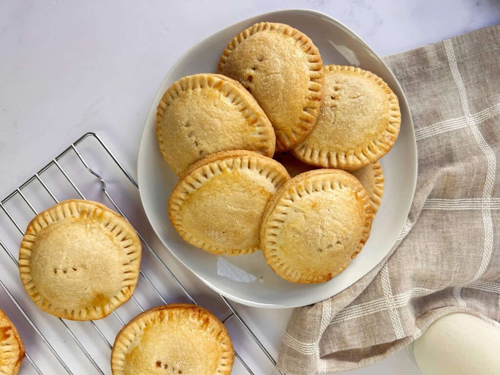 Overhead perspective displaying the round flat shapes of the finished Mexican cajeta coyotas recipe.